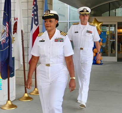 Naval Health Clinic Commanding Officer Kristen Atterbury and Vice Admiral C. Forrest Faison III walk into Thursday's ceremony.